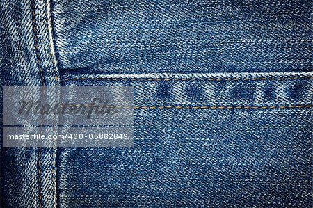 Worn blue denim jeans texture with stitch