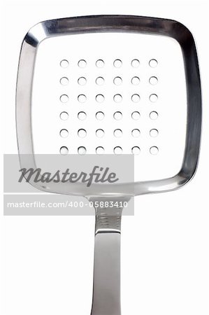 Close up view of kitchen utensil perforated spoon over white background