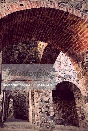 Interior of ancient stone ruin with arches