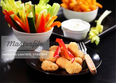 Chili cheese nuggets with raw vegetable and dip