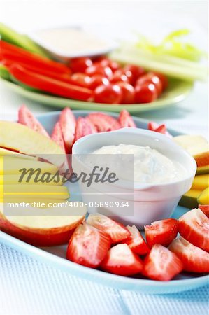 Raw  fruits and vegetables with cream cheese and yogurt dip