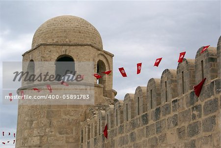 Fortress and red flags in medina of Sousse, Tunisia Fortress and red flags in medina of Sousse, Tunisia