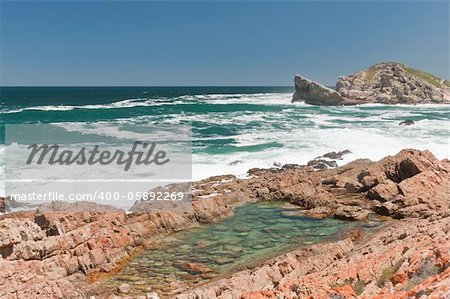 The view of the waves washing over the rocks, Robberg, South Africa