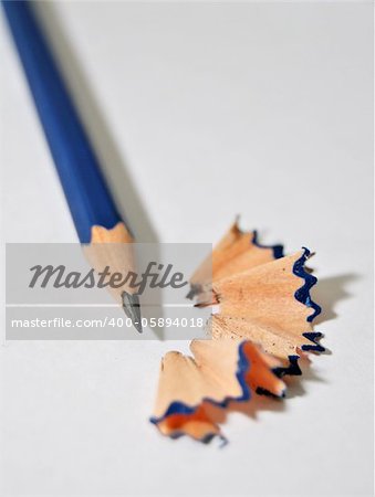 Sharpened Pencil with Wood Shavings on the blank paper