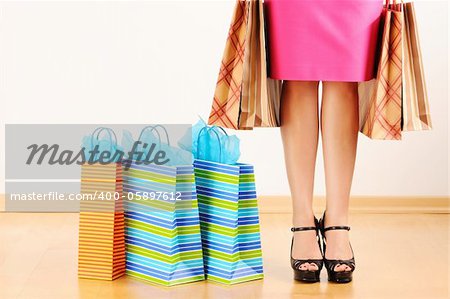 Woman's legs and shopping bags