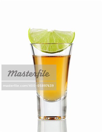 Tequila  shot with lime isolated on white