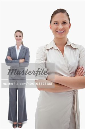 Portrait of smiling businesswomen posing against a white background
