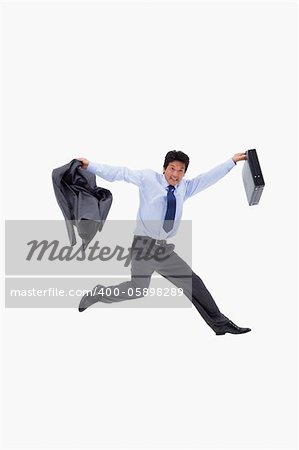 Cheerful businessman jumping while holding his jacket and a briefcase against a white background