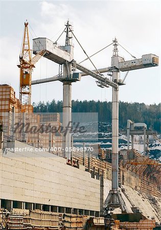 Works of tower cranes on construction of a dam on the Angara River