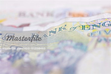 Macro image of English bank notes. Focus on £5 note.