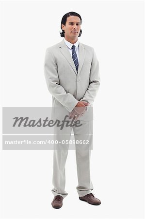 Portrait of an office worker standing up against a white background