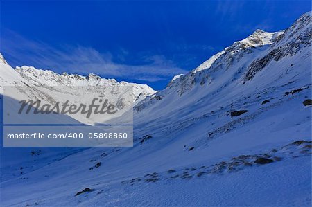 winter mountain landscape with a blue sky, Fagaras Mountains, Romania