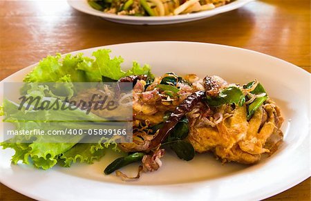 Fried fish with fresh herbs and spicy