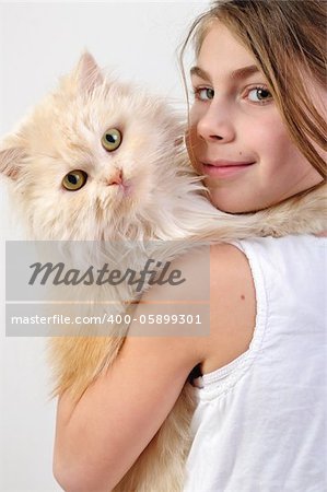 close-up portrait of a little girl with a Persian breed cat