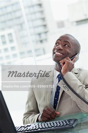 Portrait of an office worker on the phone looking away from the camera