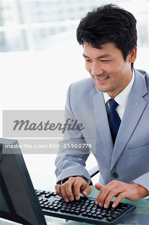 Portrait of a manager using a computer in his office