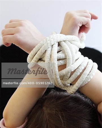 Child's hands with a rope connected