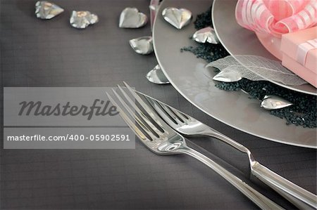 Restaurant series. Valentine' day   dinner with table setting in pink and gray  and holiday elegant  heart ornaments