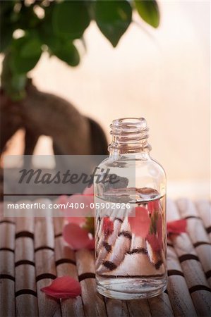 Spa and wellness  setting with floral water and flower