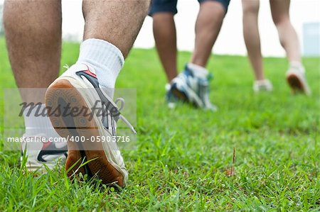 walking on sidewalk, sport shoes closeup