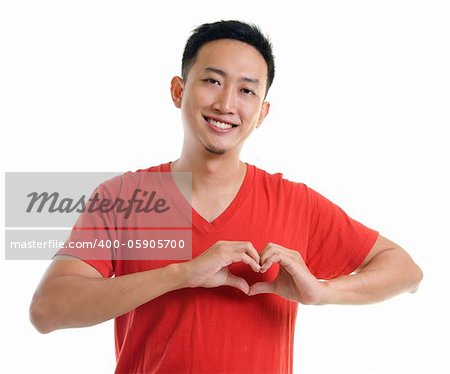 Asian young forming a heart shape on white background