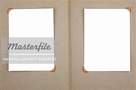 Open photo album with blank places for photos