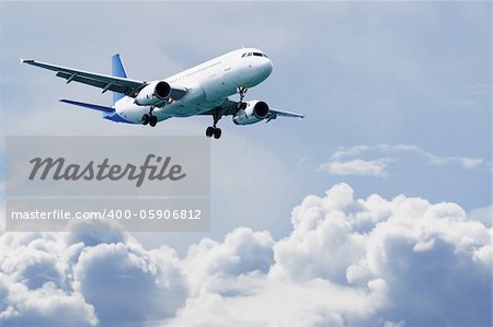 Passenger airliner flying over the clouds