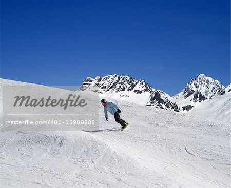 Snowboarding in high mountains