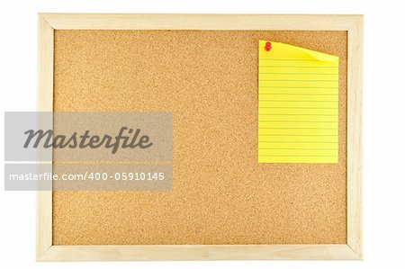 yellow paper sticky note pinned on cork notice board