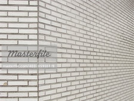 old wall with square worn ceramic white tiles