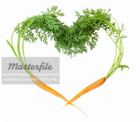 Two carrots in shape of heart on white background