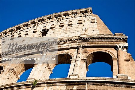 Colosseum in Rome with blue sky, landmark of the city