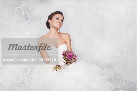 Brunet bride portrait with flowers in studio