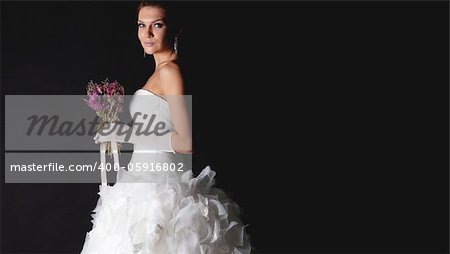 Brunet bride portrait in studio isolated on black