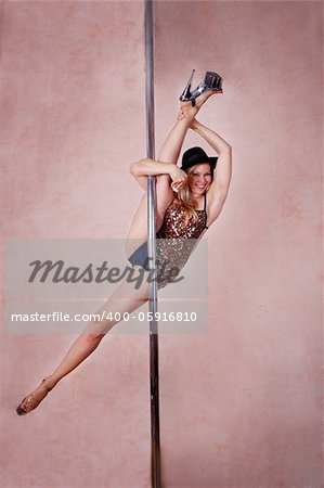 Girl making figure of poledance sport