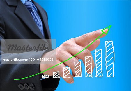 businessman hand pushing a business graph on a touch screen interface