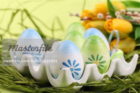 Colorful Easter eggs in an egg holder. Shallow dof