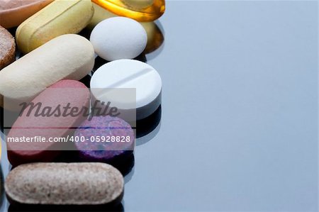 a cocktail of various tablets and pills, drugs and health supplements.