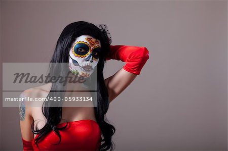 Sugar skull girl in red dress, copy-space for your text