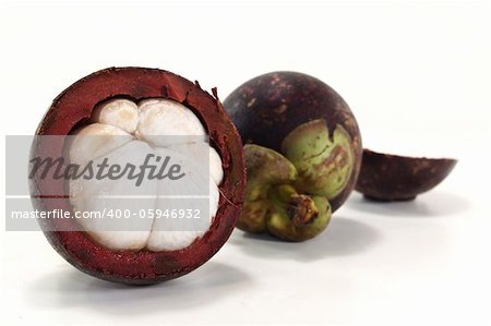 cut mangosteen fruit on a light background