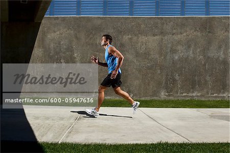 Man Running on Sidewalk