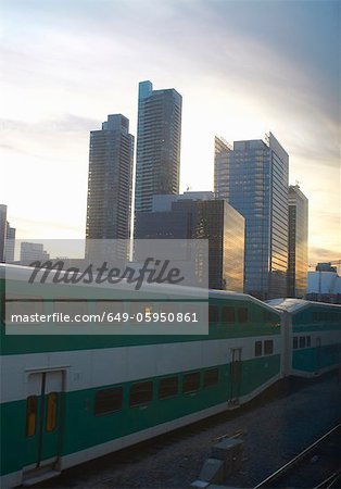 Train passing by Toronto city skyline