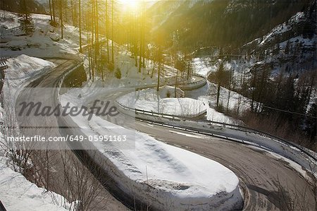 Winding road in snowy landscape