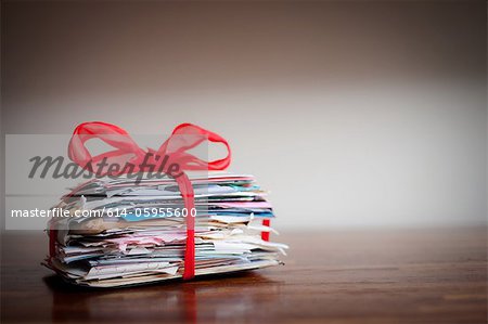 Stack of letters tied together with ribbon