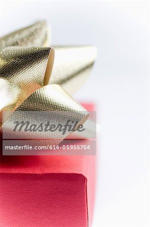 Red gift with gold bow