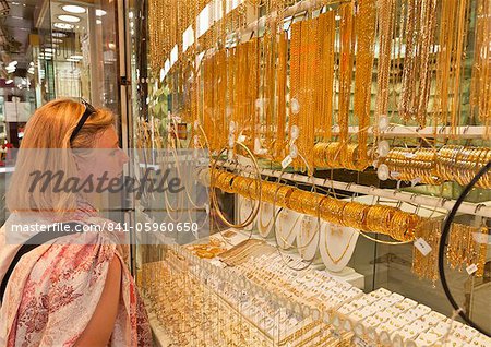 Female tourist shopping, Gold Souk Market, Deira, Dubai, United Arab Emirates, Middle East