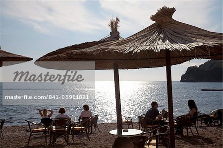 People relaxing on the beach at Budva on the Adriatic coast, Budva, Montenegro, Europe