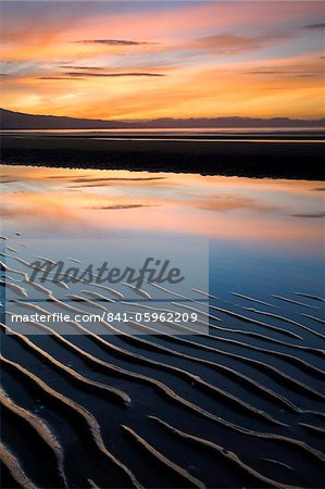 Coucher du soleil et du sable ondulations sur la plage de Pohara, Golden Bay, île du Sud, Nouvelle-Zélande, Pacifique Coucher du soleil et du sable ondulations sur la plage de Pohara, Golden Bay, île du Sud, Nouvelle-Zélande, Pacifique