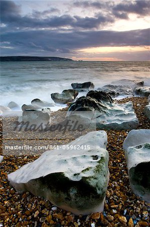 Sea defences at Hurst Spit, looking across to the Isle of Wight and the Needles, Hampshire, England, United Kingdom, Europe