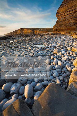 Golden evening sunshine lights up the rocks, Dunraven Bay, Southerndown, Wales, United Kingdom, Europe